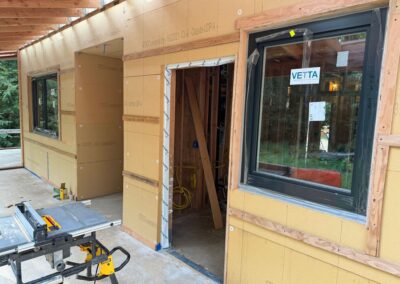 Framing with exposed insulation and window installed