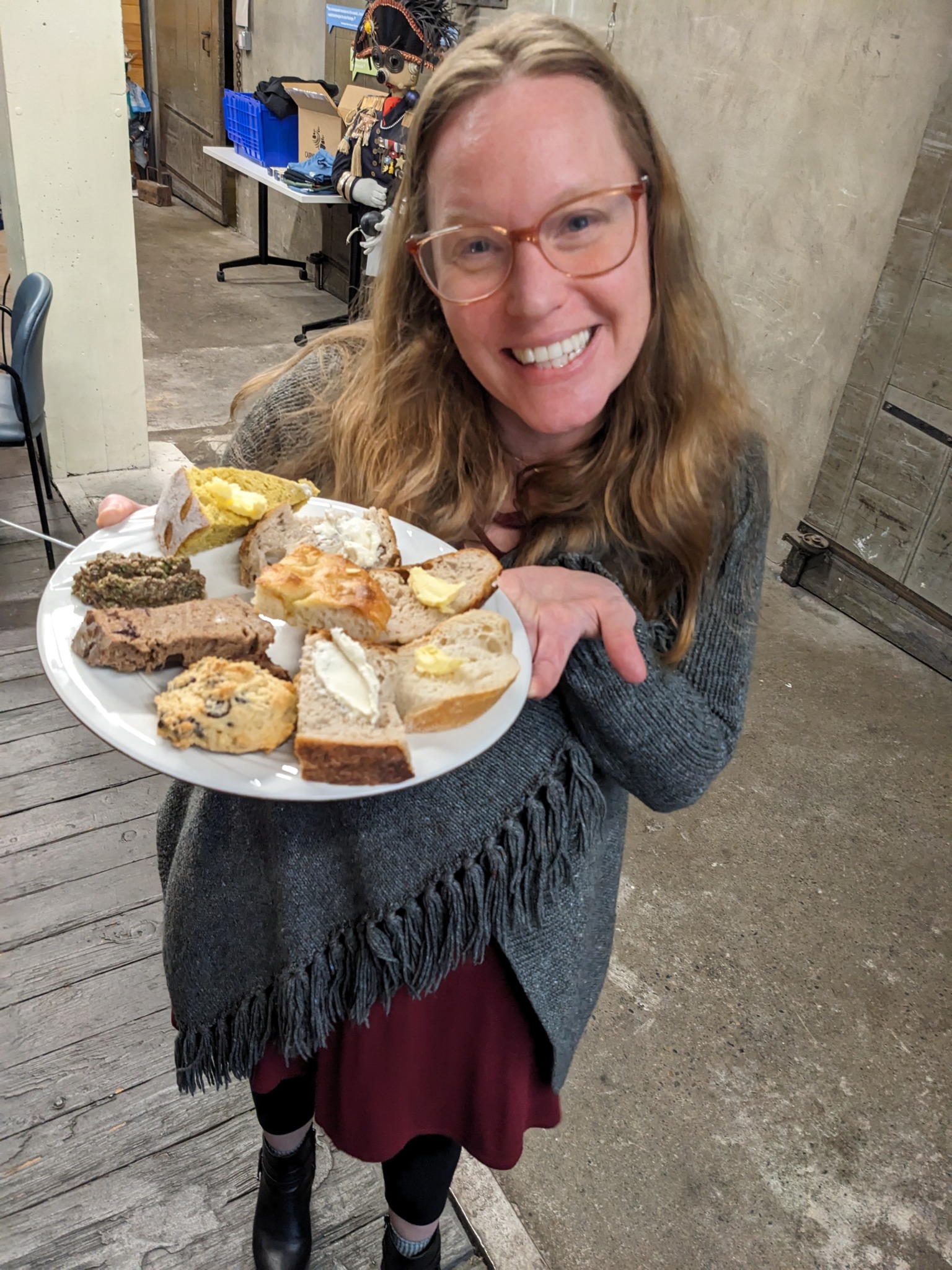 brandi holds a plate of bread