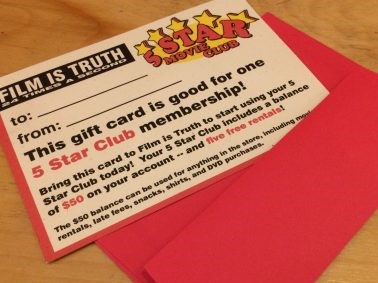 A gift certificate to Film is Truth 24 Times a Second sits on a desk with a red envelope.
