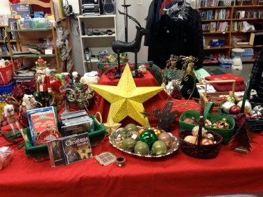 An assortment of holiday decorations and stocking stuffers displayed at Wise Buys.